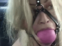 Blonde-Captive-Wearing-Giant-Ballgag.gif