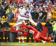 josh-allen-buffalo-bills-unsigned-hurdle-in-win-vs-chiefs-photograph_pi4533000_ff_4533365-5133...jpg