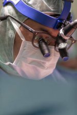 close-up-view-of-a-heart-surgeon-wearing-his-magnifying-glasses-CAVF92902.jpg